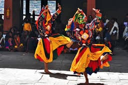 Paro Tsechu Festival Bhutan – Colourfully Costumed Dancers Performing Traditional Cham at Rinpung Dzong Courtyard
