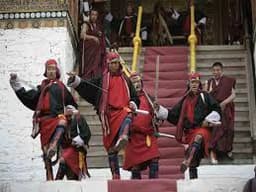 Punakha Tshechu Festival – Monks in Ceremonial Mask Dance Costumes at Punakha Dzong